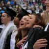 Graduates and their friends and family celebrate the achievement at the 2023 Spring Commencement on May 11, 2023. (Photo by Glenn J. Asakawa/University of Colorado)