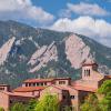 campus building with Flatirons in the background