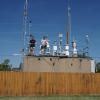 Seonsik Yun and Doug Day stand on the roof of La Casa, an air quality research site in Denver.
