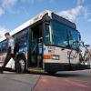 Person steps off an RTD bus