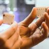 Charlotte Bellerjeau holds two 3D printed components capable of absorbing and expelling gasses