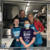 Jason, Suzi, Jacob and Sami Jewett pause from food preparation in their Bamen Ramen food truck.