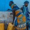 People gathering water in urban Africa