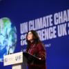 A speaker on the main stage of COP26