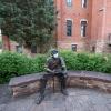 Robert Frost sculpture wearing a mask