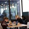 Students working on laptops and tablets