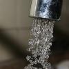 Water drops from a faucet