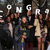 Graduate poses with family for photo after Integrative Physiology recognition ceremony