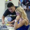 Advisor talking to student.