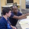 Student talking with advisor.