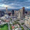 Daybreak over downtown Denver with a view of the Rocky Mountains to the west