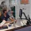 A library worker at their desk