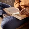 person reading a book of poetry