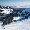Skiers on the slopes at Palisades Tahoe ski resort