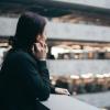 Woman looks out over railing