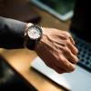 Man checks wrist watch