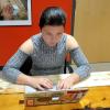 Student Alana Faller works on laptop computer