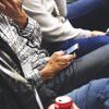 Person checks smartphone alert