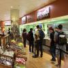 Students line up inside the Alferd Packer Grill