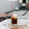 root beer float with ice cream and a red striped paper straw