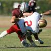 Two football players smash into each other on the field