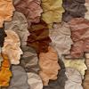 A collage of different colored paper faces