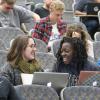 Students talk, sit in auditorium
