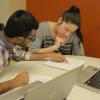 A student tutors another student at an ASAP open hours session