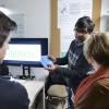 A person shows his work during the ATLAS Institute Research Showcase.
