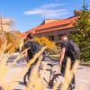 Students walk with bikes on campus