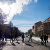 Students walk across campus on a cold day