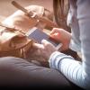 Woman checks smartphone