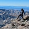 Person standing near edge of cliff - 'Be Boulder' 2018 photo contest winner by Ruiqi Li