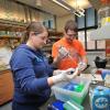 Faculty work in lab at Jennie Smoly Caruthers Biotechnology Building
