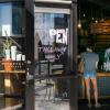 A woman at a coffee shop open to take out service in Denver, Colo.