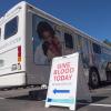 Bonfils Blood Center bus with 'Give Blood Today' sign
