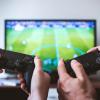 video game controllers in front of esports game