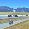 West bound traffic and a west bound bicyclist make their way into Boulder