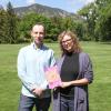 Walker Sampson and Heather Bowden hold their book on the CU Boulder campus