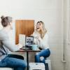 two people working on laptops and drinking coffee
