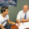 Attorney Bruce Sarbaugh consults a student