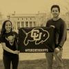 Students holding a Forever Buffs flag in front of Norlin