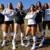 CU women's volleyball players posing in front of the Flatirons