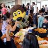 Chip interacts with residents of Graduate and Family Housing who were evacuated due to flooding at a special lunch served up by CU football team members and coaches and CU Women's Lacrosse players. (Photo by Glenn Asakawa/University of Colorado)
