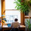 Campus community member works on laptop indoors