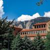 campus building with Flatirons in the background