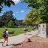 Campus community members walking outside on campus