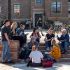Campus community members gathered on steps