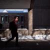 Student walking on a snowy campus