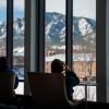 Students looking out at a snowy campus